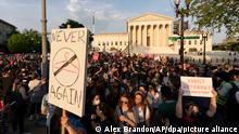 Demonstrators protest outside of the US Supreme Court 