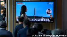 People watch a TV screen showing a news program reporting about North Korea's missile launch with file footage, at a train station in Seoul, South Korea, Wednesday, May 4, 2022. North Korea has launched a ballistic missile toward its eastern waters on Wednesday, South Korean and Japanese officials said, days after North Korean leader Kim Jong Un vowed to bolster his nuclear arsenal at the fastest possible pace and threatened to use them against rivals. (AP Photo/Lee Jin-man)