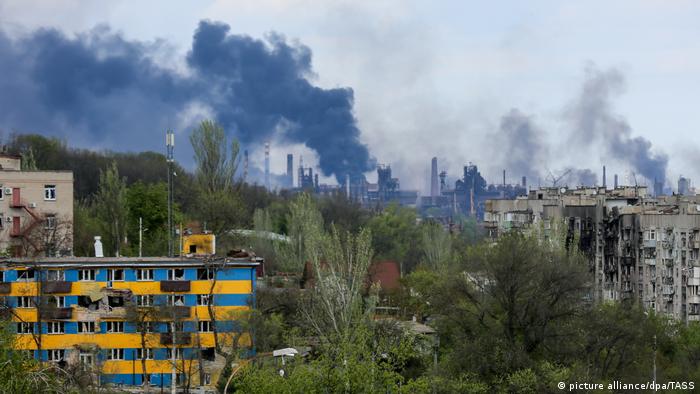 In this photo provided by Russian news agency TASS, smoke is seen rising from the Azovstal steel plant in Mariupol