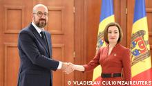 Moldovan President Maia Sandu shakes hands with European Council President Charles Michel during a meeting in Chisinau, Moldova May 4, 2022. REUTERS/Vladislav Culiomza