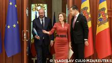 Moldovan President Maia Sandu shows the way to European Council President Charles Michel during a meeting in Chisinau, Moldova May 4, 2022. REUTERS/Vladislav Culiomza