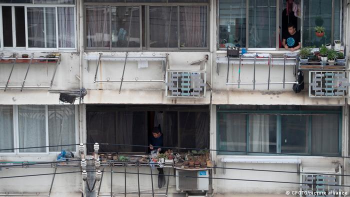 People on their balconies in Shanghai 