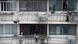 People on their balconies in Shanghai People on their balconies in Shanghai