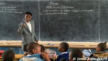 Bayard Kumwimba Dyuba, 84, a teacher since 1968 and who is awaiting retirement, teaches in his 5th year primary (CM2) classroom at the Kiwele II primary application school in Lubumbashi on February 14, 2022. - Teachers, administrative agents and civil servants in the Democratic Republic of Congo still work, desperately waiting for a pension and recognition that does not come.
But for years, many state officials have been forgotten, despite a 2016 law stipulating that those who have reached the age of 65 or have accumulated 35 years of career are eligible for retirement. (Photo by Junior KANNAH / AFP)