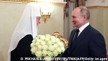 Russian President Vladimir Putin congratulates Patriarch of Moscow and All Russia Kirill on the occasion of the 12th anniversary of his enthronement in Moscow on February 1, 2021. (Photo by Mikhail KLIMENTYEV / SPUTNIK / AFP) (Photo by MIKHAIL KLIMENTYEV/SPUTNIK/AFP via Getty Images)