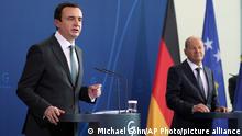 German Chancellor Olaf Scholz, right, and the Prime Minister of Kosovo, Albin Kurti, left, address the media during a joint press conference after a meeting at the Chancellery in Berlin, Germany, Wednesday, May 4, 2022. (AP Photo/Michael Sohn)
