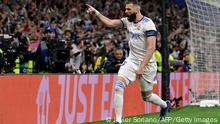 Real Madrid's French forward Karim Benzema celebrates scoring his team's third goal during the UEFA Champions League semi-final second leg football match between Real Madrid CF and Manchester City at the Santiago Bernabeu stadium in Madrid on May 4, 2022. (Photo by JAVIER SORIANO / AFP) (Photo by JAVIER SORIANO/AFP via Getty Images)