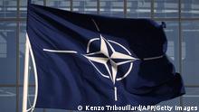 A picture shows the flag of the North Atlantic Treaty Organization (NATO) prior to the Meeting of NATO Ministers of Defence in Brussels, on October 21, 2021. (Photo by Kenzo Tribouillard / AFP) (Photo by KENZO TRIBOUILLARD/AFP via Getty Images)