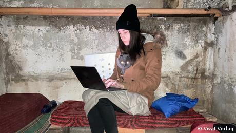 A worker at Vivat publishing house in Kharkiv works from her computer in a bomb shelter.