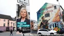 A Sinn Fein election poster hangs from a lamp post in West Belfast, Northern Ireland, Tuesday, May 3, 2022. Sinn Fein, a force in Irish republicanism on both sides of the Irish border looks likely to become the largest party in the assembly, according to polls ahead of the May 5, 2022 local elections. (AP Photo/Peter Morrison)