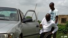 Video still from our own video (DW Africa) about a taxi driver with no legs in Nigeria.
