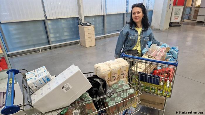 A woman with a lot of humanitarian aid in Kyiv