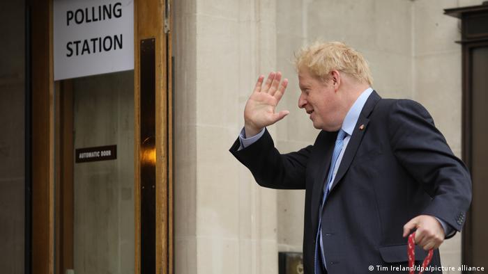  Boris Johnson waves as he enters a polling station to vote during local elections