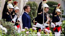 French President Emmanuel Macron reviews military troops during the ceremony of his inauguration for a second term at the Elysee palace, in Paris, France, Saturday, May 7, 2022. Macron was reelected for five years on April 24 in an election runoff that saw him won over far-right rival Marine Le Pen. (Gonzalo Fuentes/Pool via AP)