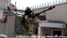 BIR AL-ABED (EGYPT), Dec. 1, 2017 Egyptian soldiers are seen on an armored vehicle during a Friday prayer outside the Al-Rawda Mosque where a terrorist attack took place in Bir al-Abed of North Sinai, Egypt, on Dec. 1, 2017. A terrorist attack took place here on Nov. 24, killing at least 305 Muslim worshippers, including children, and wounding over 120 others