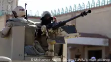 BIR AL-ABED (EGYPT), Dec. 1, 2017 Egyptian soldiers are seen on an armored vehicle during a Friday prayer outside the Al-Rawda Mosque where a terrorist attack took place in Bir al-Abed of North Sinai, Egypt, on Dec. 1, 2017. A terrorist attack took place here on Nov. 24, killing at least 305 Muslim worshippers, including children, and wounding over 120 others