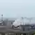 Дым над территорией металлургического комбината "Азовсталь" в Мариуполе