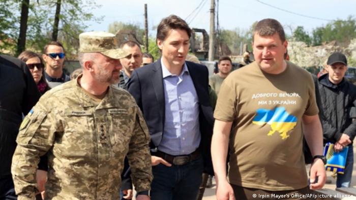 This image provided by the Irpin Mayor's Office shows Canadian Prime Minister Justin Trudeau walking with mayor Oleksandr Markushyn, right, in Irpin, Ukraine