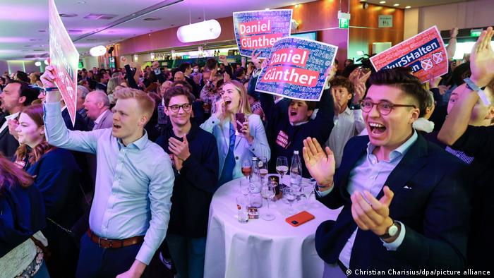 People cheer at the CDU election party