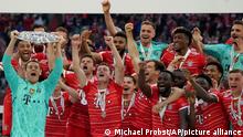 Bayern's players celebrate with the championship trophy after the German Bundesliga soccer match between Bayern Munich and Stuttgart, at the Allianz Arena, in Munich, Germany, Sunday, May 8, 2022. (AP Photo/Michael Probst )