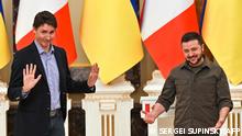 Ukrainian President Volodymyr Zelensky (R) and Canada's Prime Minister Justin Trudeau (L) gestures during a joint press conference in Kyiv on May 8, 2022 amid the Russian invasion of Ukraine. - Canadian Prime Minister Justin Trudeau visited Irpin outside the capital of Ukraine, its mayor said, where Russian forces were accused of atrocities against civilians, before meeting with President Zelensky and reaffirm Canada's unwavering support for the Ukrainian people. (Photo by Sergei SUPINSKY / Oleksandr Markushyn Telegram Channel / AFP)