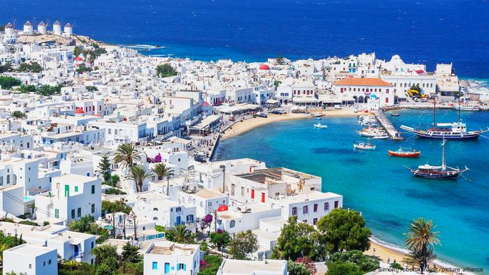 View of Mykonos island with its white buildings and azure sea