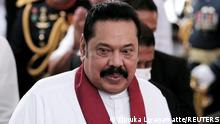 FILE PHOTO: Sri Lanka's Prime Minister Mahinda Rajapaksa reacts during his swearing in ceremony as the new Prime Minister, at Kelaniya Buddhist temple in Colombo, Sri Lanka, August 9, 2020. REUTERS/Dinuka Liyanawatte/File Photo