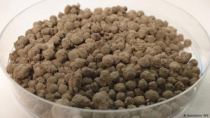 A bowl of dry fertilizer pellets