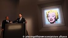 Chairman of Christie's Americas Marc Porter and Christie's Chairman of 20th and 21st Century Art Alex Rotter speak standing next to 'Shot Sage Blue Marilyn' by Andy Warhol which is on display after an announcement that it will go up for Auction at Christie's on Monday, March 21, 2022 in New York City. The iconic Andy Warhol silk-screen portrait of Hollywood starlet Marilyn Monroe is on the block for $200 million, a record asking price for any 20th Century painting. Photo by John Angelillo/UPI Photo via Newscom picture alliance