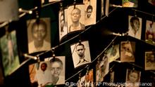 Family photographs of some of those who died hang in a display in the Kigali Genocide Memorial Centre in Kigali, Rwanda Saturday, April 5, 2014. The country will commemorate on April 7, 2014 the 20th anniversary of the genocide when ethnic Hutu extremists killed neighbors, friends and family during a three-month rampage of violence aimed at ethnic Tutsis and some moderate Hutus, leaving a death toll that Rwanda puts at 1,000,050. (AP Photo/Ben Curtis)