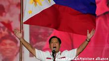 Presidential candidate, Ferdinand Marcos Jr., the son of the late dictator gestures to the crowd at their last campaign rally known as Miting De Avance on Saturday, May 7, 2022 in Paranaque city, Philippines. About 67 million registered Filipino voters will pick a new president on Monday, with Ferdinand Marcos, Jr, son and namesake of the ousted dictator leading pre-election surveys, and incumbent Vice President Leni Robredo, who leads the opposition, as his closest challenger. (AP Photo/Aaron Favila)