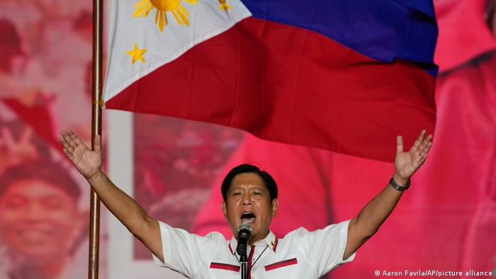 Ferdinand Marcos Jr., the son of the late dictator, gestures to the crowd at a campaign rally
