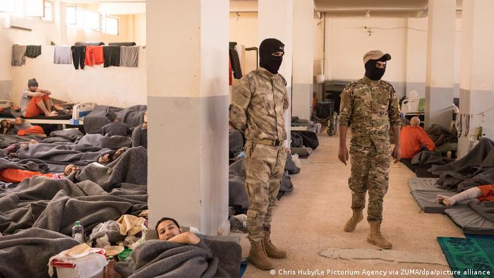 Syrian jail with hundreds of people squashed into a room