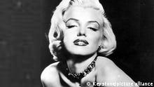 Marilyn Monroe wearing a collar necklace.