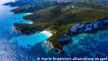 Aerial of a spectacular rocky beach with turquoise waters.