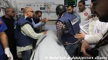 JENIN, WEST BANK - MAY 11: The dead body of Shirin Abu Akile, the female reporter of Al-Jazeera television channel, who lost her life as a result of fire opened by Israeli soldiers in the Jenin refugee camp, is seen at the Ibn-i Sina hospital in the city of Jenin, West Bank on May 11, 2022. Nedal Eshtayah / Anadolu Agency