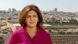 In this undated photo provided by Al Jazeera Media Network, Shireen Abu Akleh stands with the Old City of Jerusalem can be seen behind her In this undated photo provided by Al Jazeera Media Network, Shireen Abu Akleh stands with the Old City of Jerusalem can be seen behind her