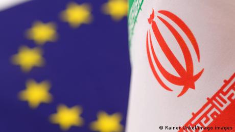 The flags of European Union EU and Iran
