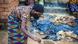 Malawian woman seen preparing food on an outdoors stove Malawian woman seen preparing food on an outdoors stove