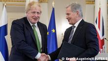 British Prime Minister Boris Johnson and Finnish President Sauli Niinisto shake hands, after signing a declaration between the UK and Finland to deepen their defence and security co-operation, amid Russia's invasion of Ukraine, at the Presidential Palace, in Helsinki, Finland, May 11, 2022. Frank Augstein/Pool via REUTERS