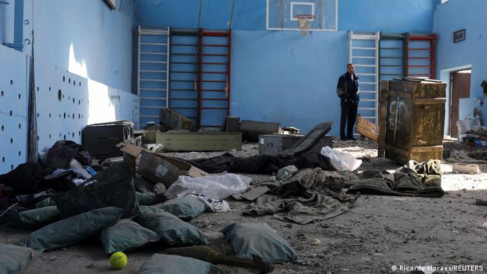 A rocket is pictured inside a multi-sports court of a school, where, according to residents, Russian soldiers were based before the Ukrainian Army retook the Vilhivka village