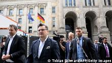 12.05.2022 *** Ukraine's Foreign Minister Dmytro Kuleba (C) walks with Lars Klingbeil (L), co-leader of Germany's social democratic SPD party, in front of the Reichstag building that houses the Bundestag (lower house of parliament) in Berlin during a visit on May 12, 2022. (Photo by Tobias SCHWARZ / AFP) (Photo by TOBIAS SCHWARZ/AFP via Getty Images)