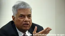 Sri Lanka Prime Minister Ranil Wickremesinghe addresses reporters in Colombo on April 10, 2016, shortly after returning from a three-day official visit to China. Wickremesinghe, who held talks with Chinese President Xi Jinping, said the island will unveil new investment laws aimed at encouraging much needed foreign investments, including those from China. / AFP / ISHARA S.KODIKARA (Photo credit should read ISHARA S.KODIKARA/AFP via Getty Images)