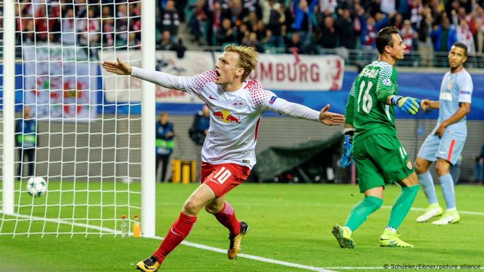 Leipzig's Emil Forsberg celebrates with his arms outstretched after scoring in the Champions League game against Monaco