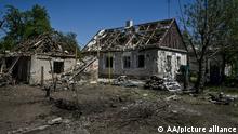 KOMYSHUVAKHA, UKRAINE - MAY 12: Damaged houses are seen after the 18 missiles hit the civil settlements of Komyshuvakha, Zaporizhzhia Oblast, Ukraine on May 12, 2022. One person was killed and three others were injured due to the missile attacks, while the bombardment destroyed 60 buildings. Stringer / Anadolu Agency