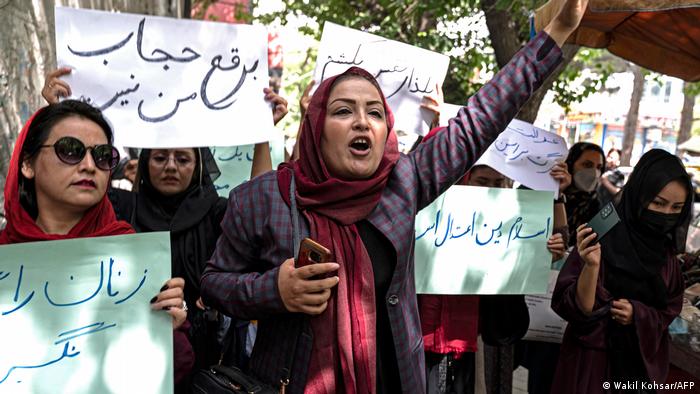 Women demonstrate in Kabul against the Taliban's new regulations.