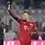 Robert Lewandowski waving to the Bayern Munich fans.