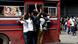 Protestors cling to a bus in Colombo, the capital of Sri Lanka, ahead of a curfew . Protestors cling to a bus in Colombo, the capital of Sri Lanka, ahead of a curfew .