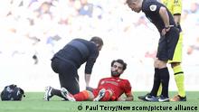 May 14, 2022, London, United Kingdom: London, England, 14th May 2022. Mohamed Salah of Liverpool receives medical attention after he picks up an injury before being substituted during the Emirates FA Cup match at Wembley Stadium, London. Photo via Newscom picture alliance