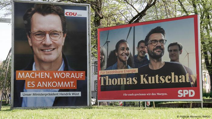 Campaign posters showing the state-premier candidates from the CDU and SPD 